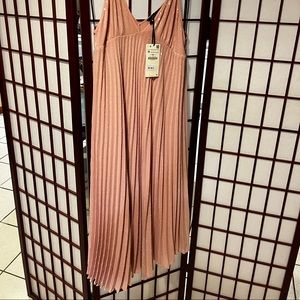 New with ticket. Sequins around pleated midi dress